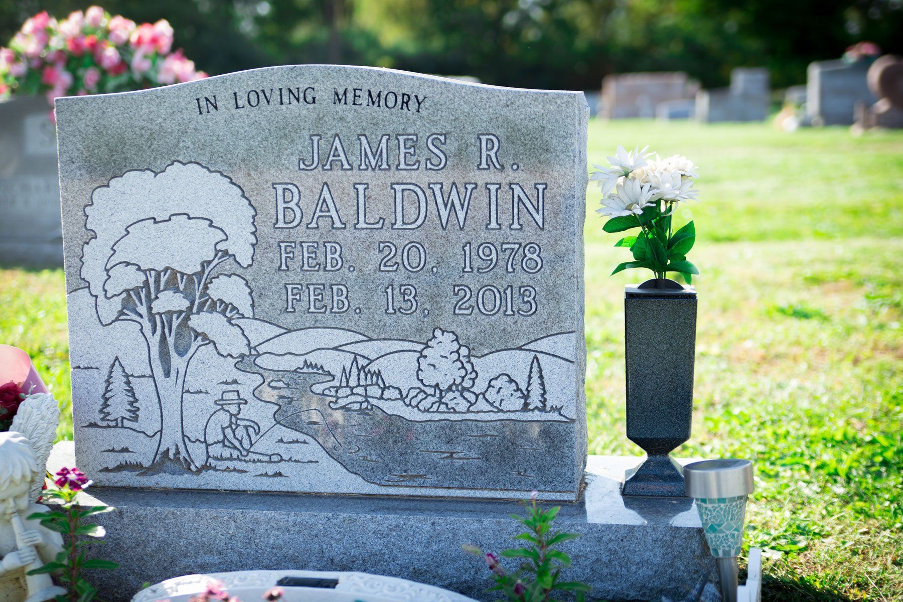 Memorials — Tombstone with Flowers on Side in Columbus, Oh