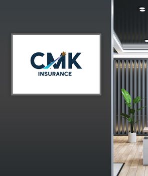A sign on a wall that says cmk insurance