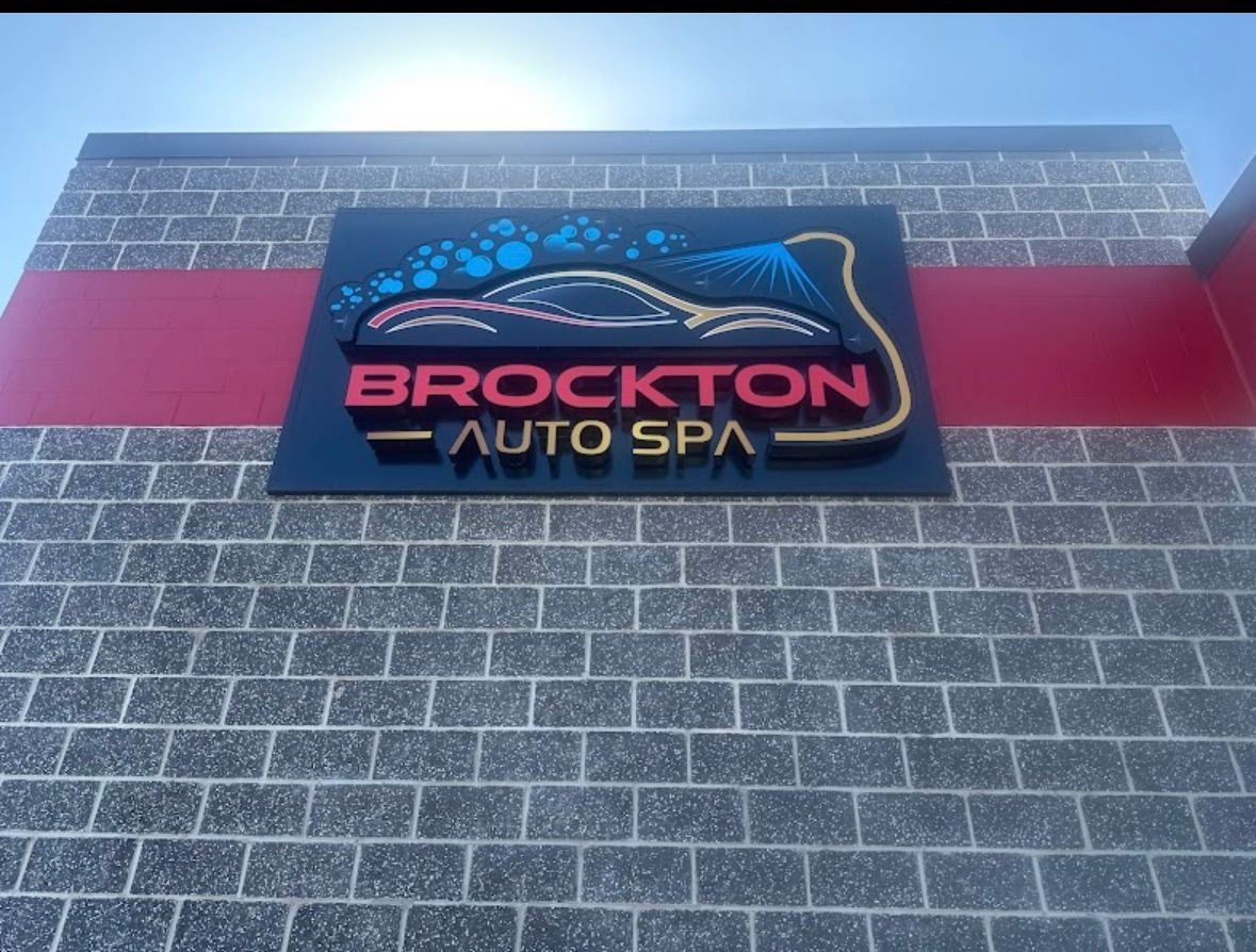 A brockton auto spa sign on a brick building