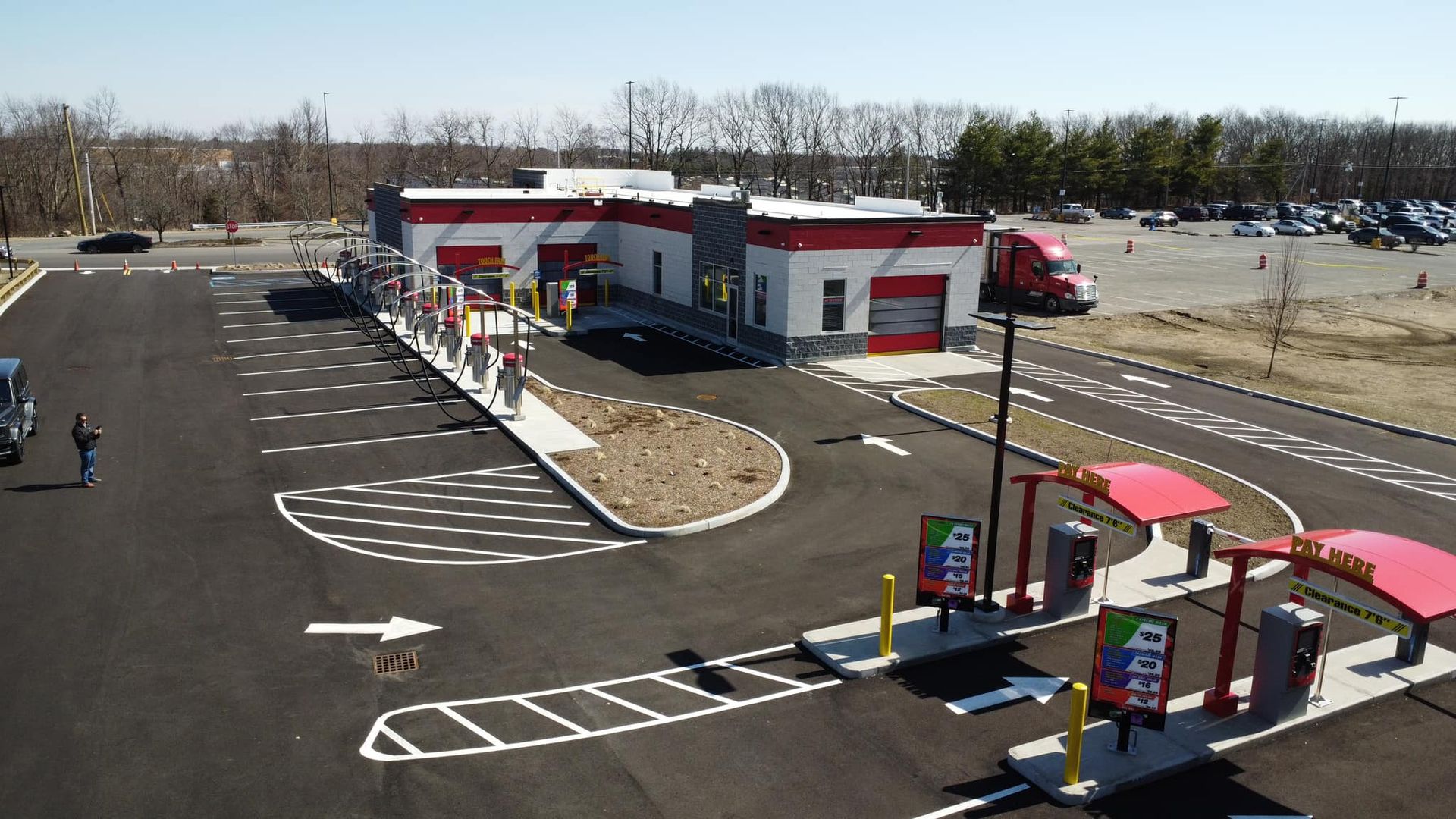 An aerial view of a car wash in a parking lot
