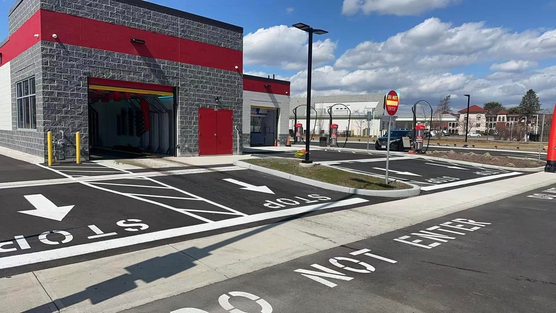 A car wash with a parking lot and a stop sign