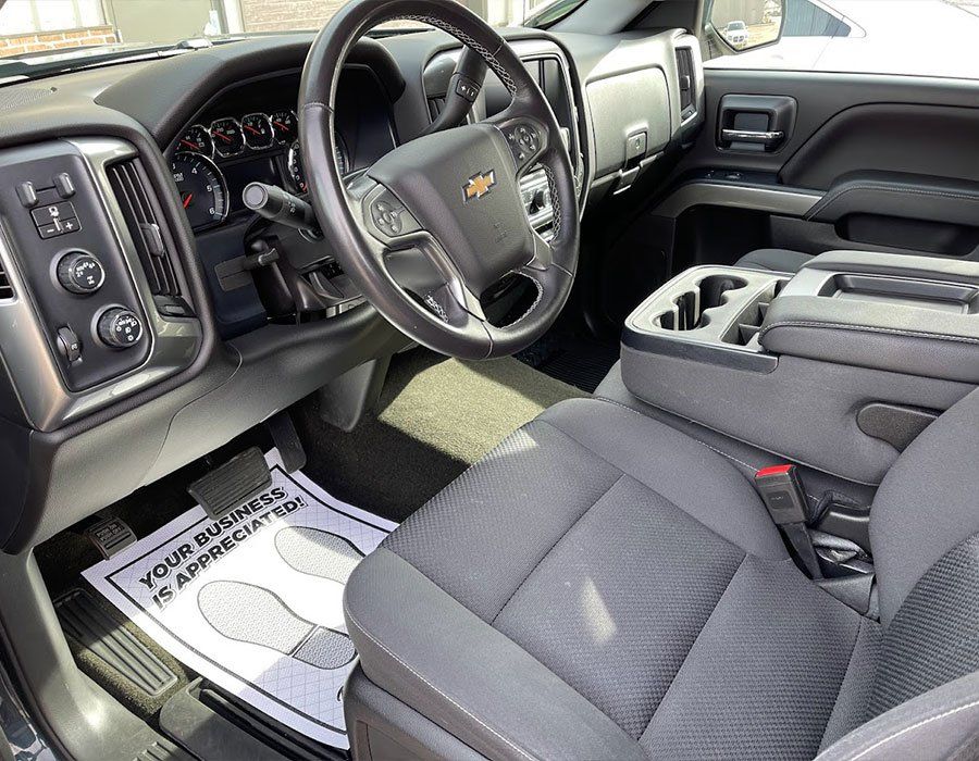 The interior of a truck with a paper on the floor that says your business is connected
