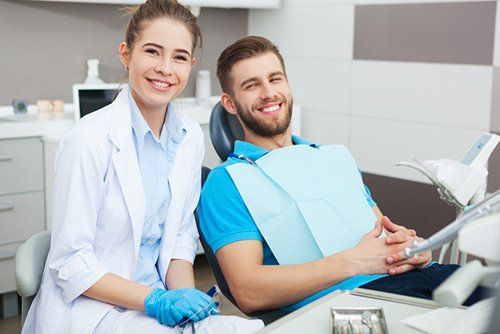 General Dentistry — Female Dentist and Young Man at the Dental Office in El Paso, TX