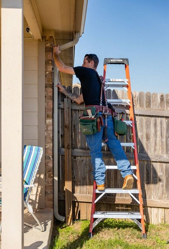 ASRGS owner installing rain gutters on home in Kyle, Tx