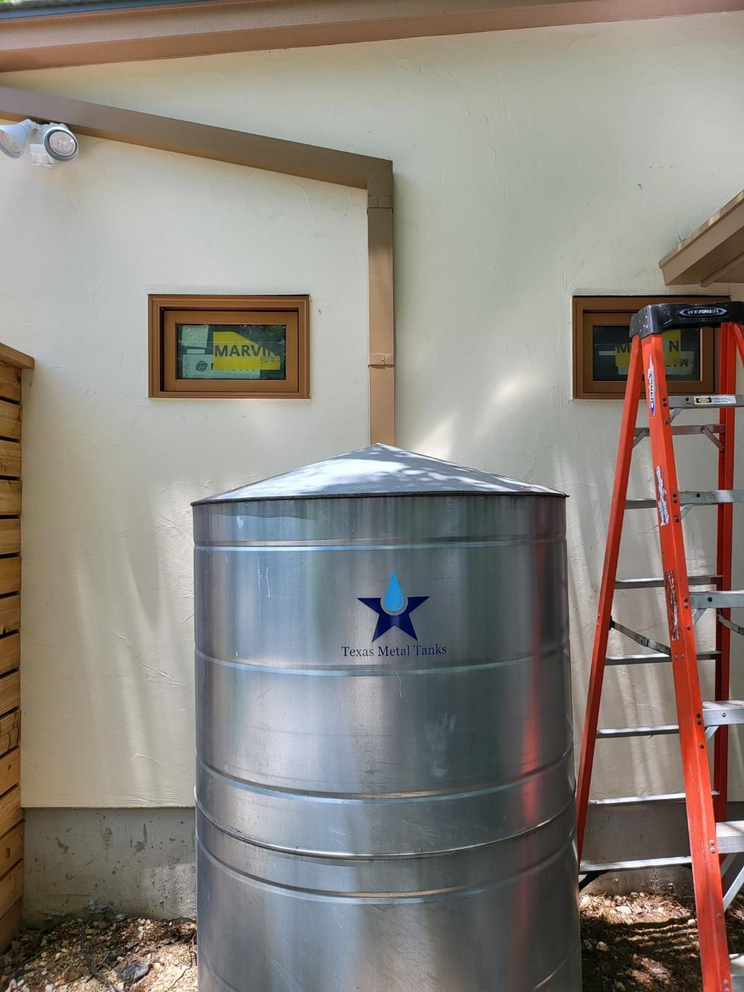 Water collection tank installed by ASRGS gutter company on home in Mission Hills Ranch in New Braunfels
