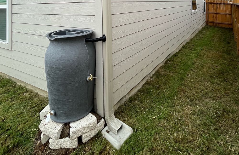 gray aesthetic rain water collection system in austin tx