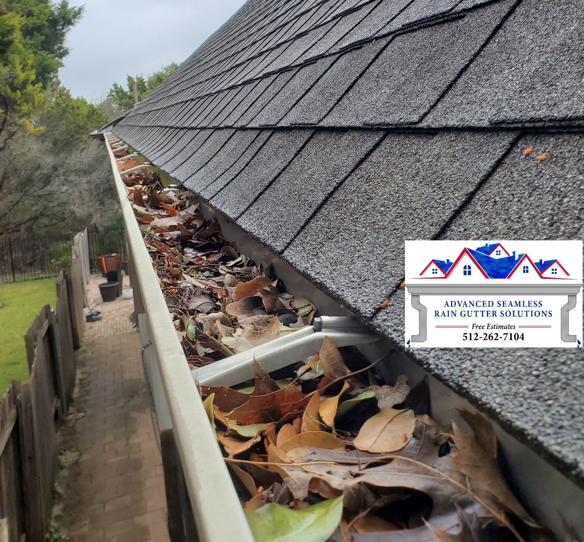 New Braunfels home with leaves clogging gutters with no leaf protection for the gutters