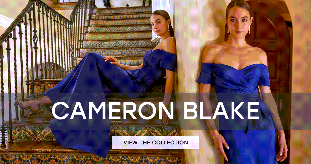 Woman in blue gown on staircase,