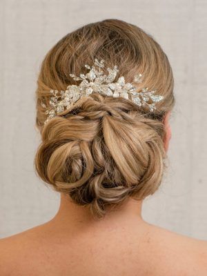Updo hairstyle with a crystal hairpiece.