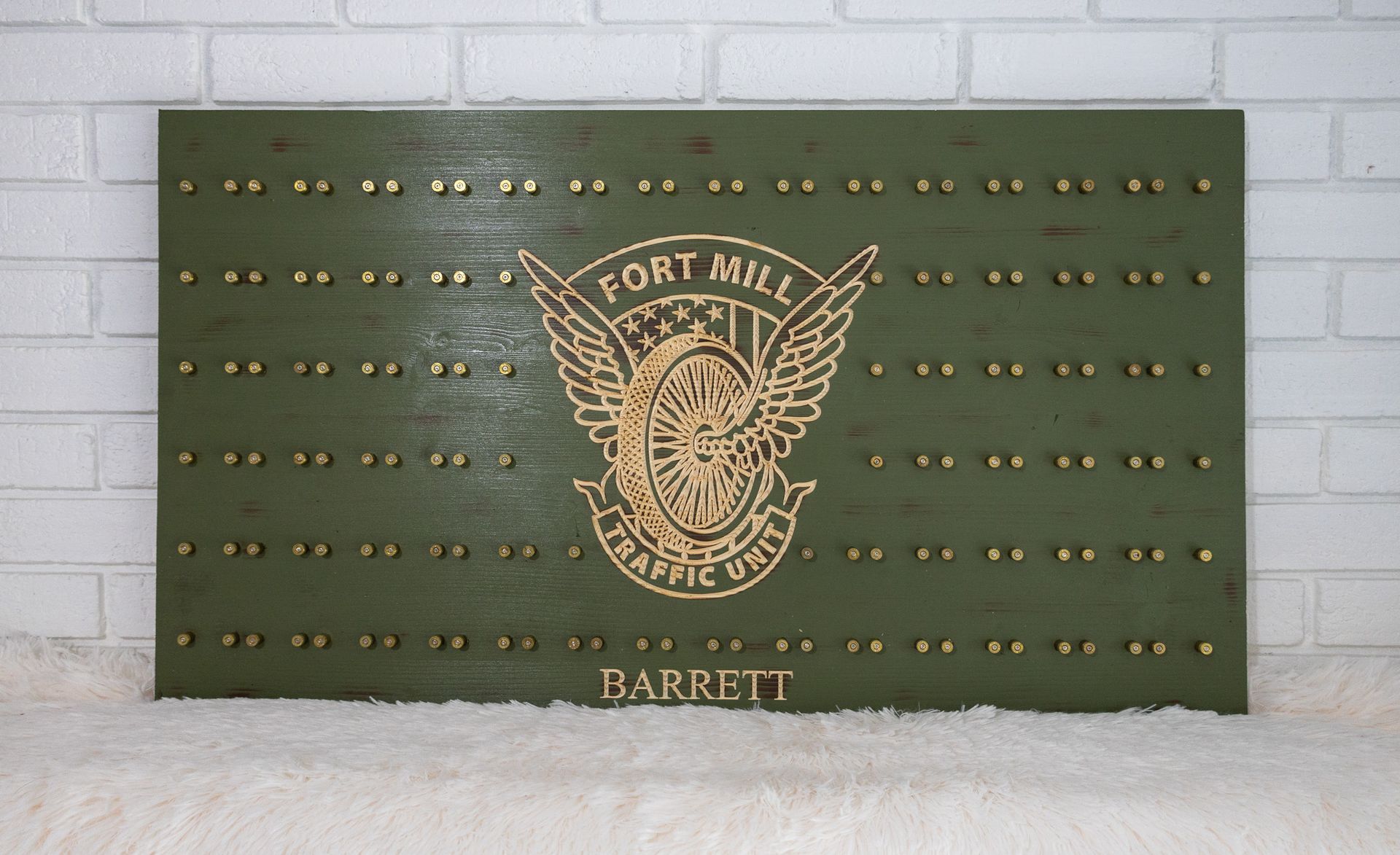 Green wooden plaque with 