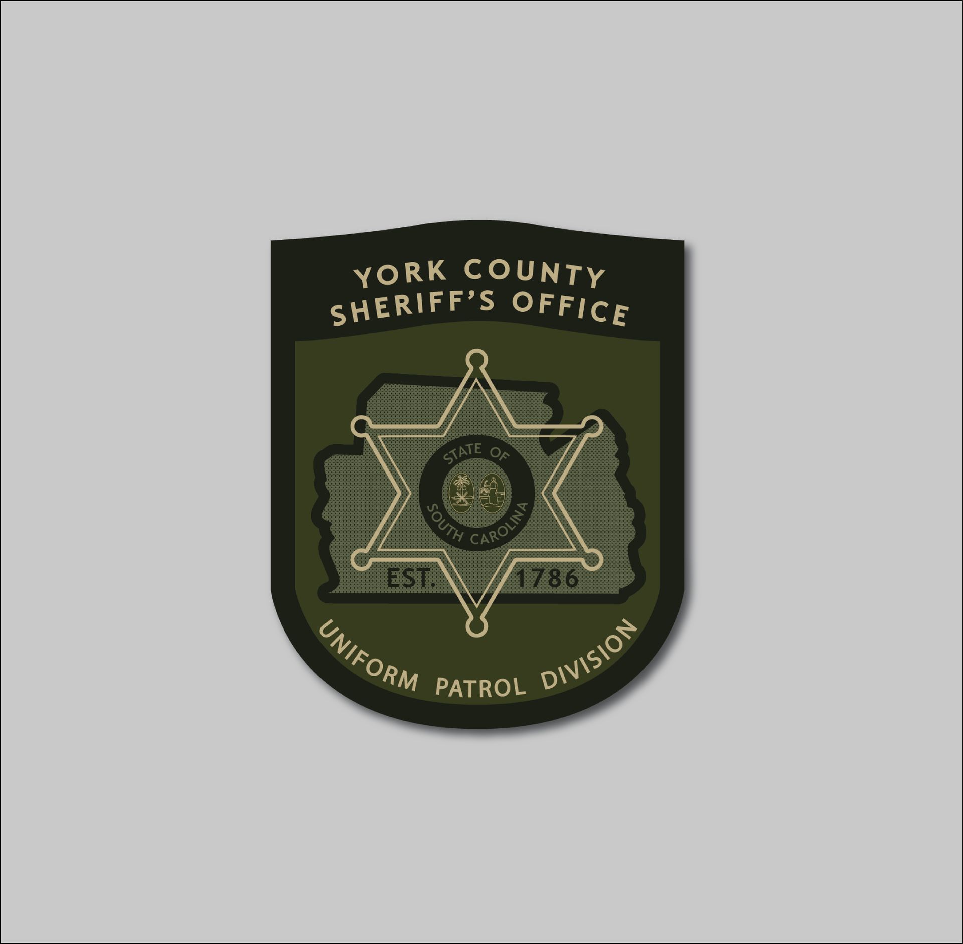 York County Sheriff's Office Uniform Patrol Division badge, dark green, with a six-pointed star and text.