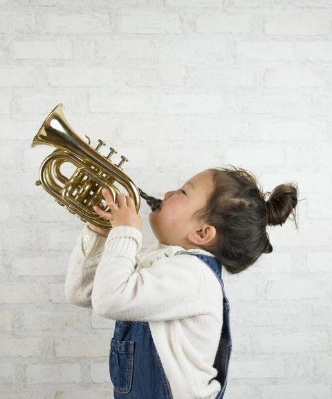 Young Girl Playing Trumpet