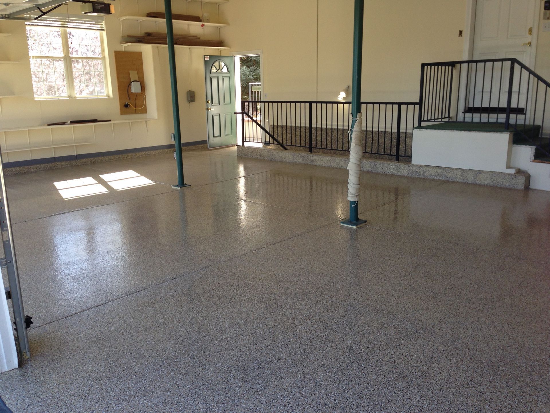 Picture of a garage with a new epoxy coated floor.