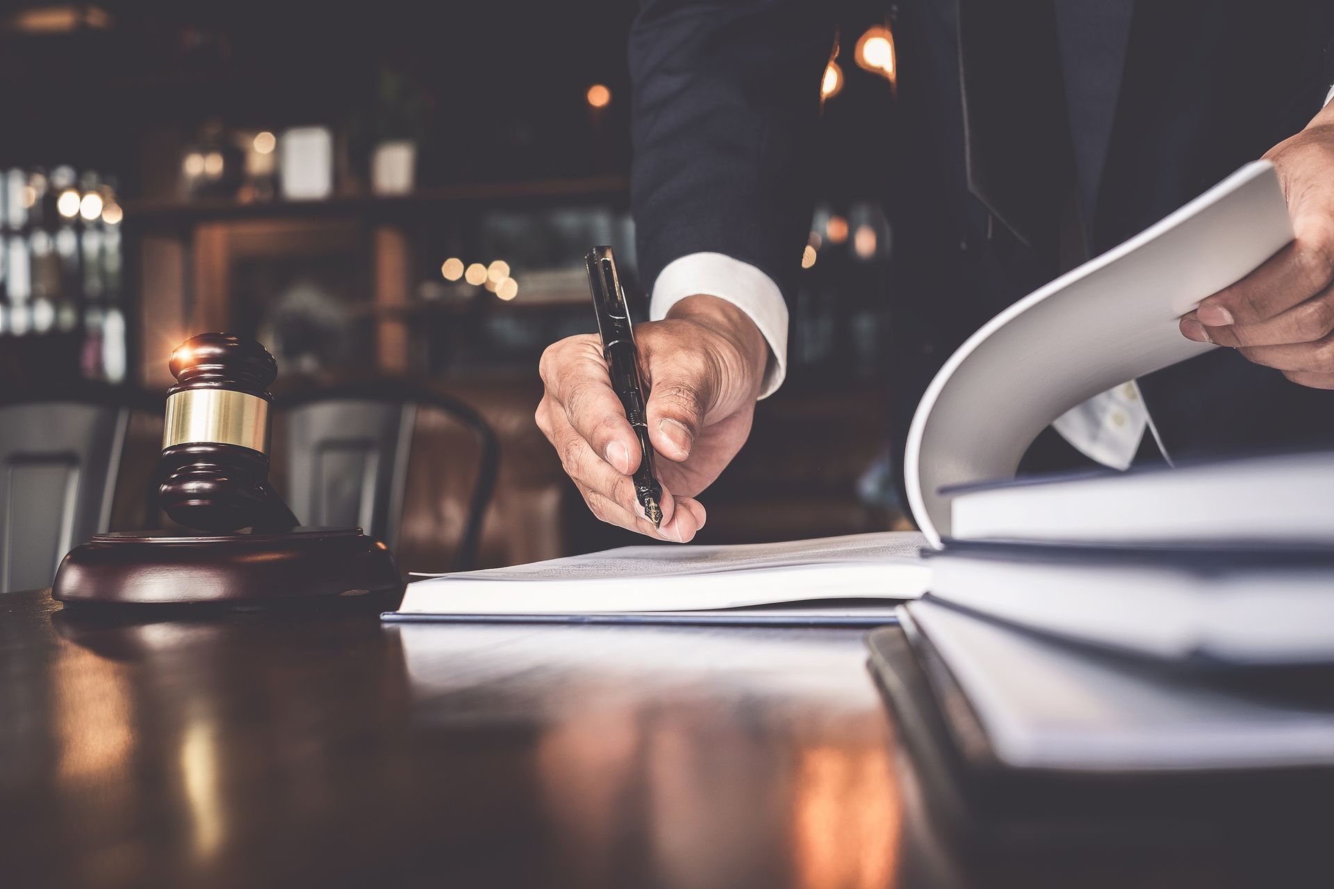 A person writing on a book | probate lawyer in Gallatin TN | The Stubbs Law Group A person writing on a book | probate lawyer in Gallatin TN | The Stubbs Law Group