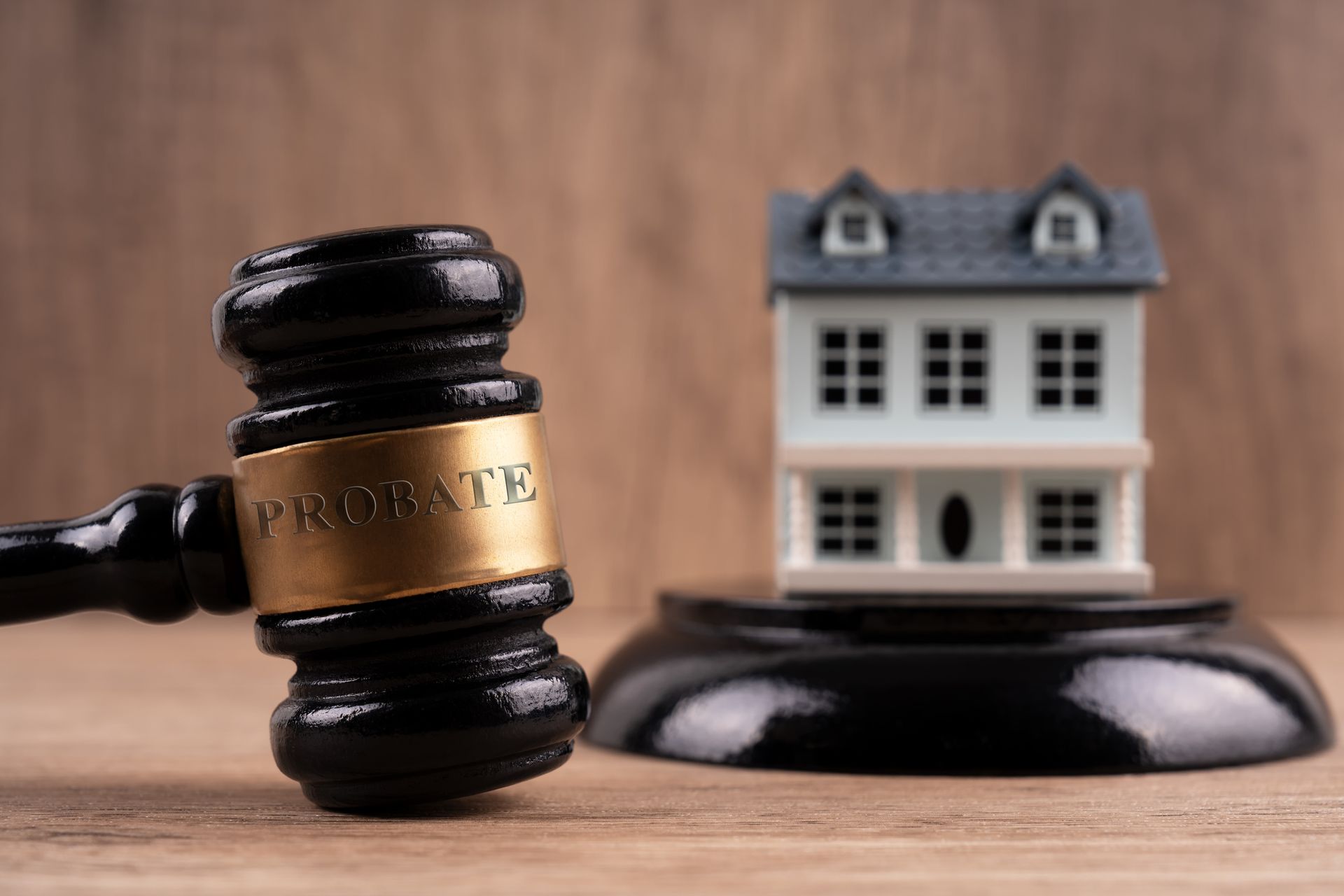 Gavel with the word probate and model house.