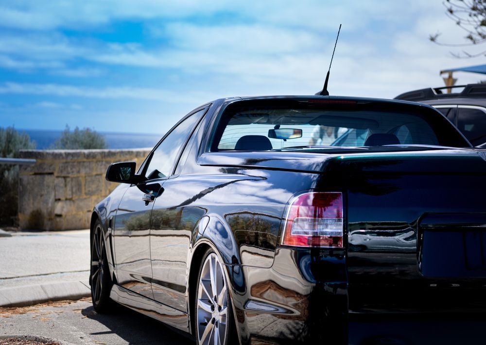 A Black Ute Parked at Ocean Lookout — ATD Automotive in North Wollongong, NSW