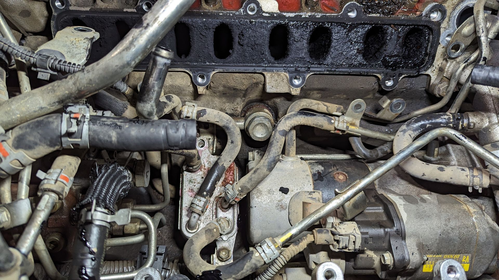 Engine bay with removed intake manifold, hoses, and components visible  — ATD Automotive in North Wollongong, NSW
