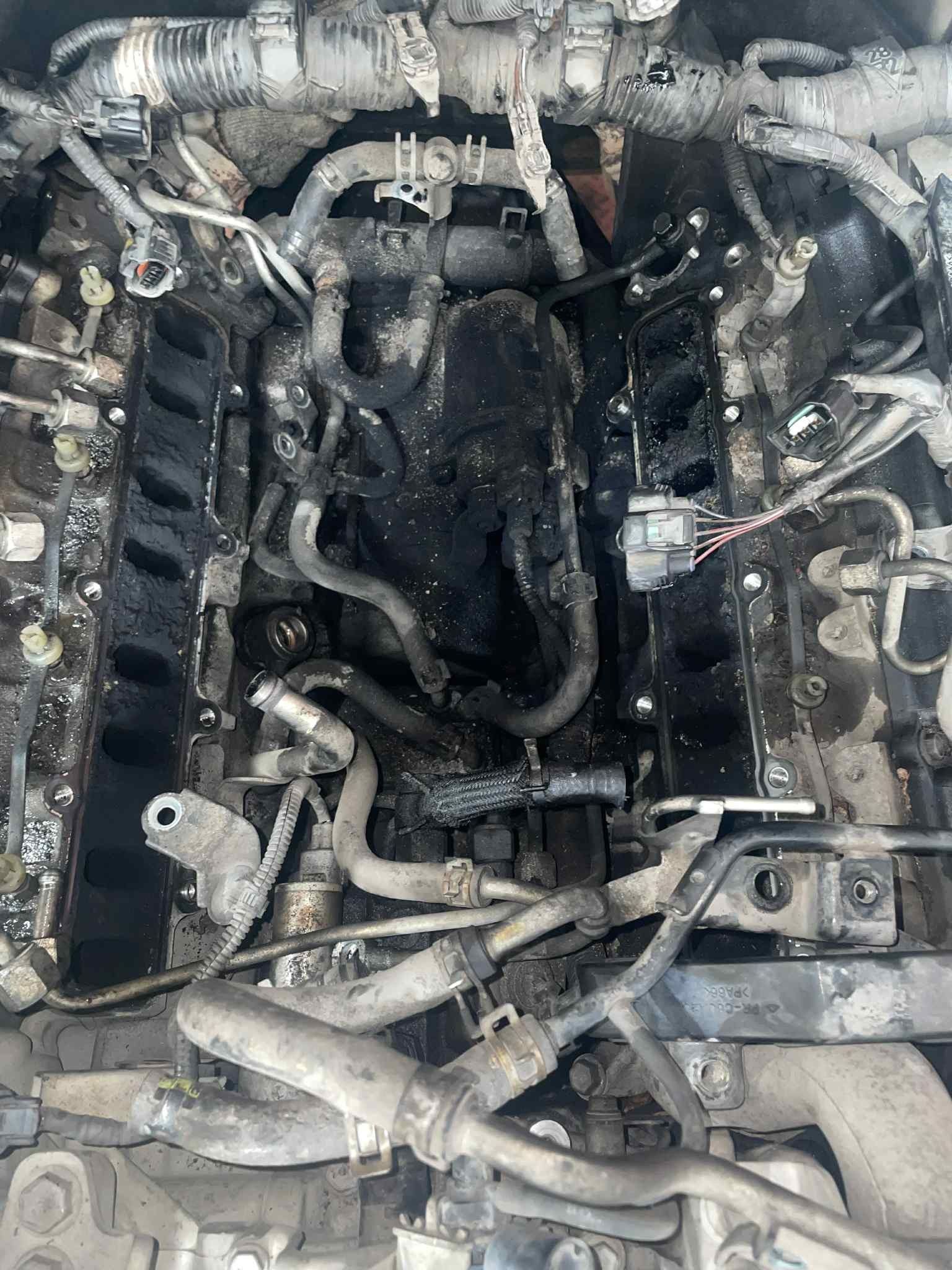 Engine Bay, Heavily Damaged by Fire, with Charred Components and Debris — ATD Automotive in North Wollongong, NSW