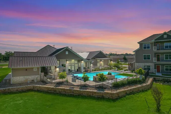 Top-rated apartment complex in Temple, TX with pool and modern exterior