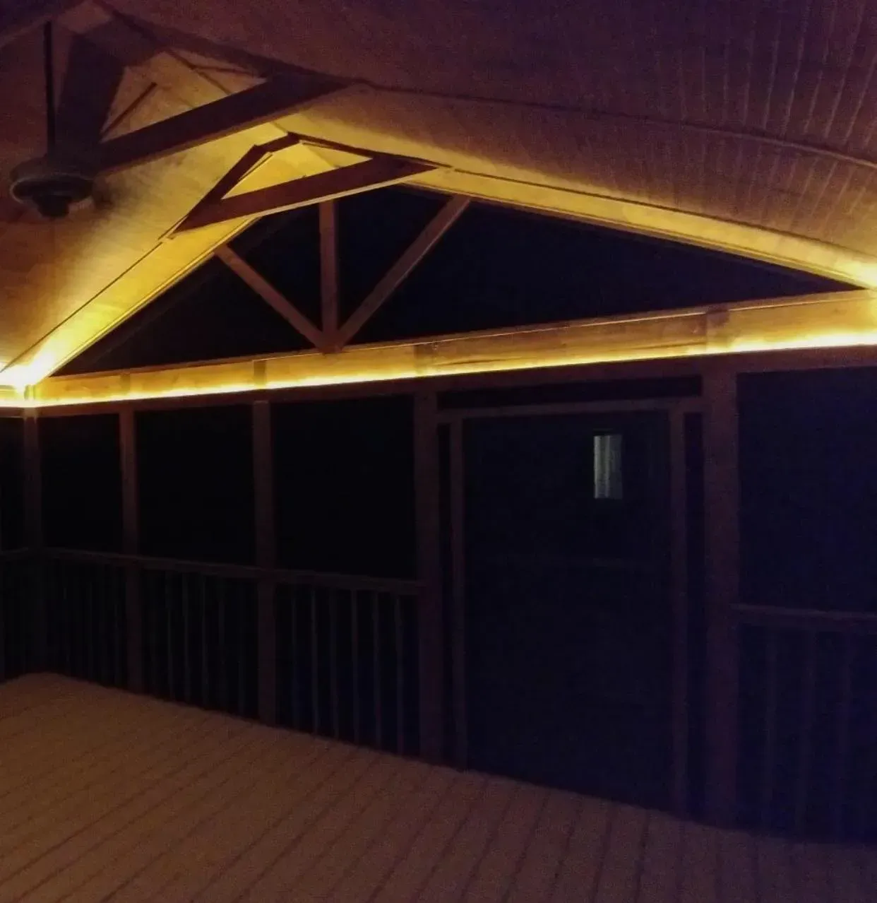 A dark room with a light on the ceiling