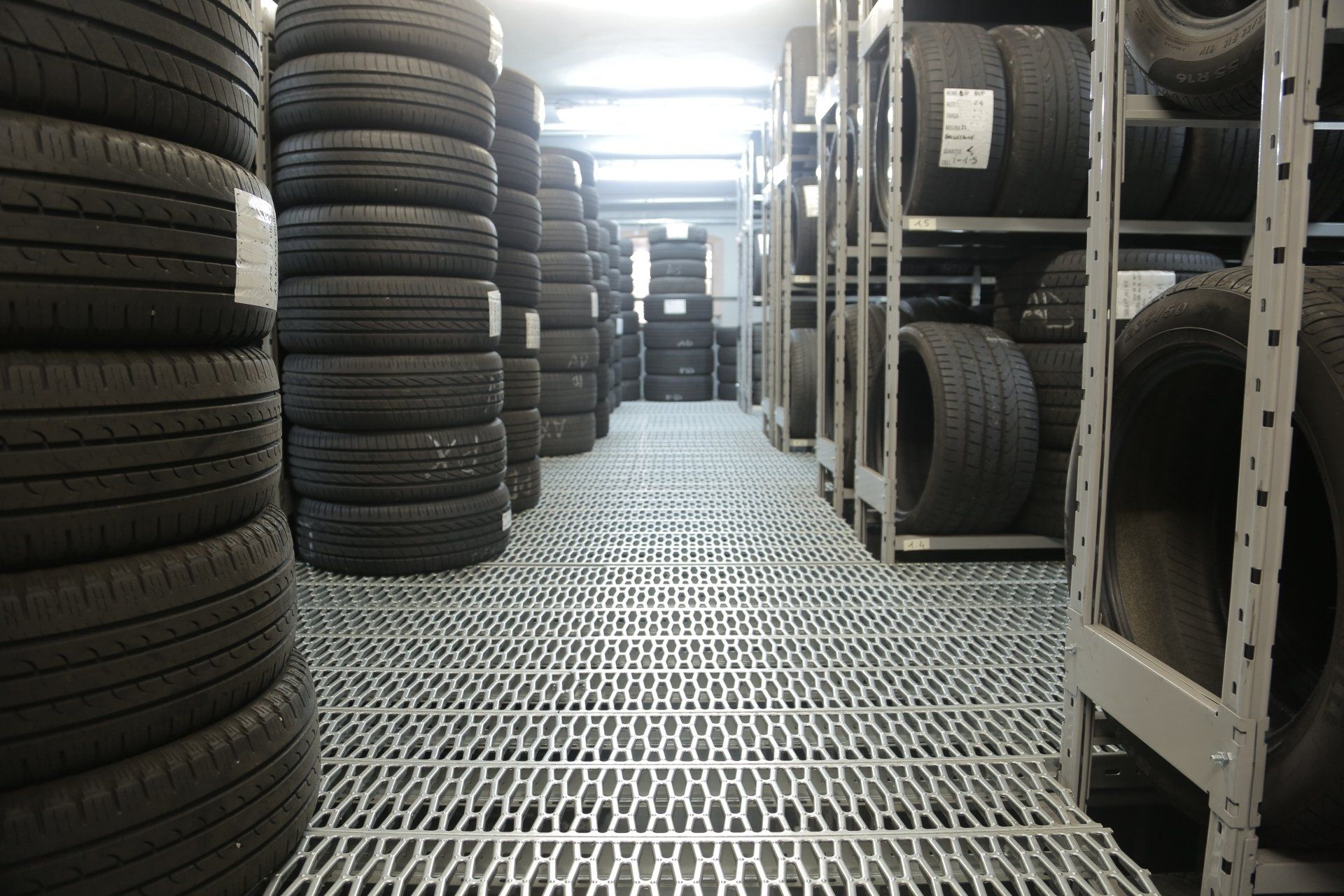 A warehouse filled with lots of tires on shelves