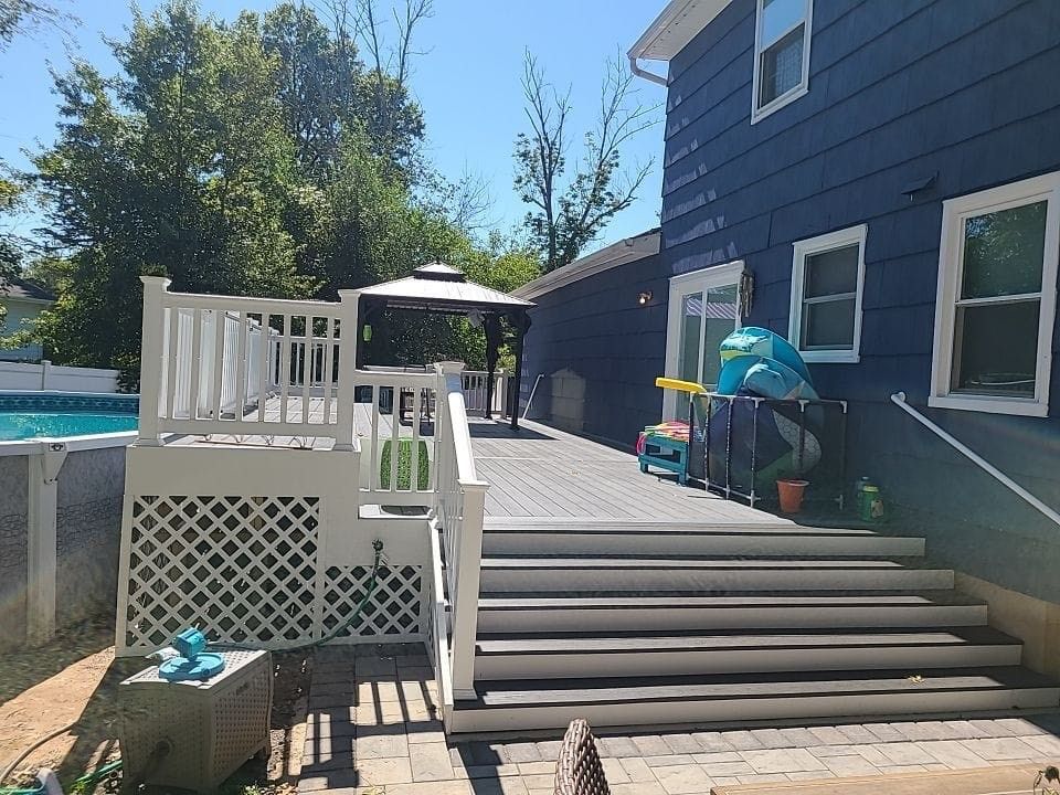 A house with a blue roof and a white porch.