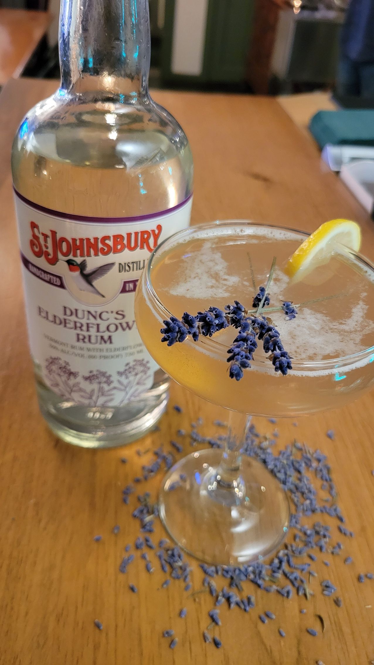 Lavender cocktail and bottle of Dunc's Elderflower Rum.
