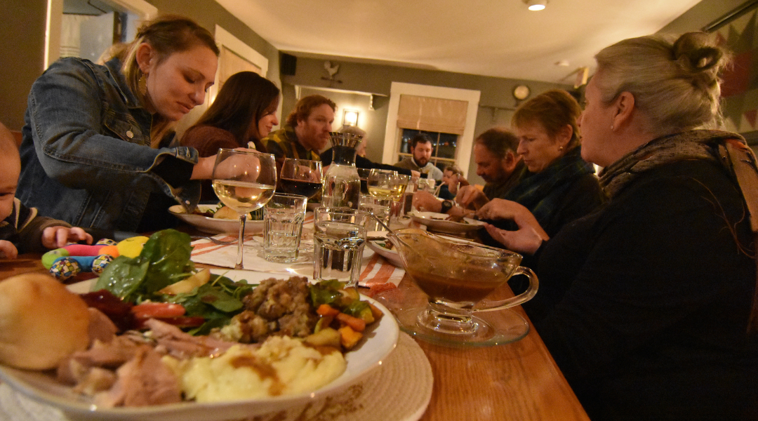 A family celebrating Thanksgiving over dinner at The Wildflower in Vermont