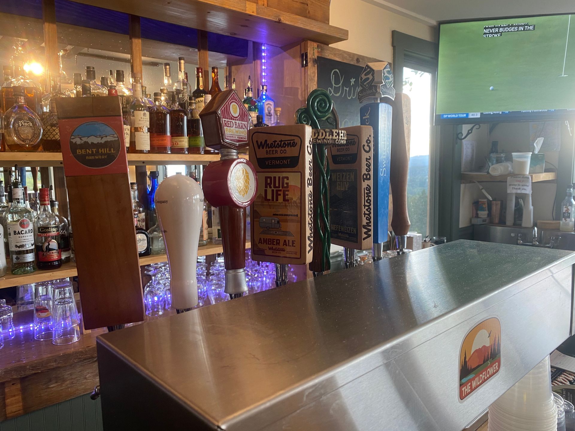 Close up of The Wildflower's bar and beer taps with various local brewers on tap.