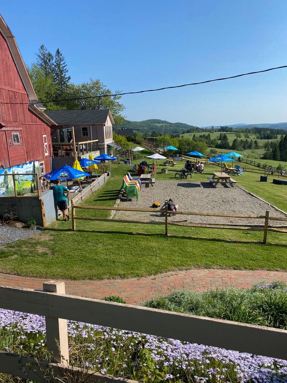 The seating and cornhole area at The Wildflower in East Burke, Vermont