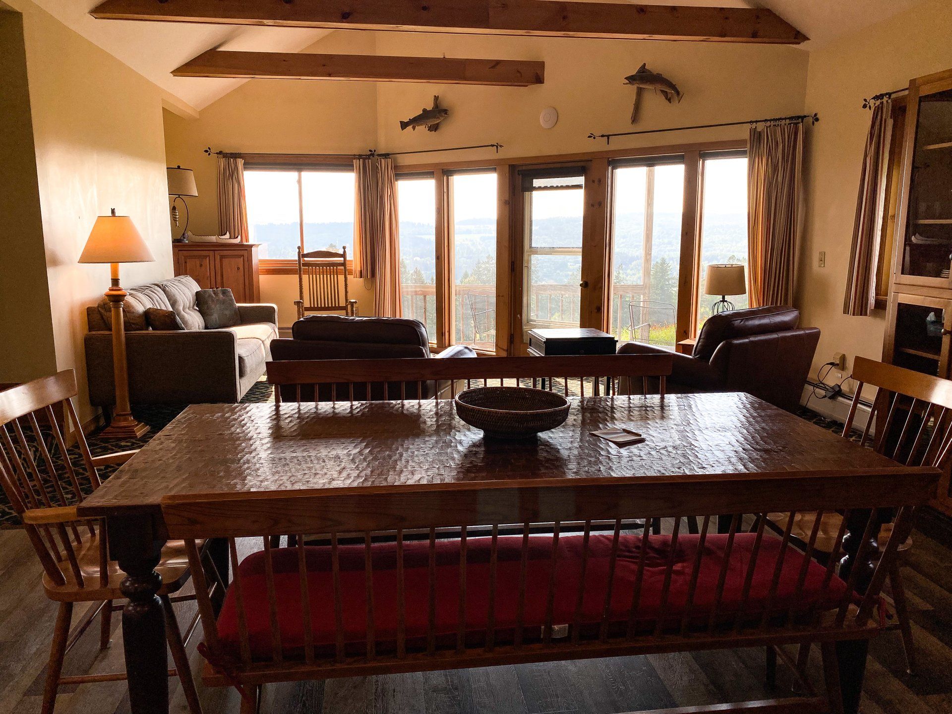 A living room with a wooden table and chairs