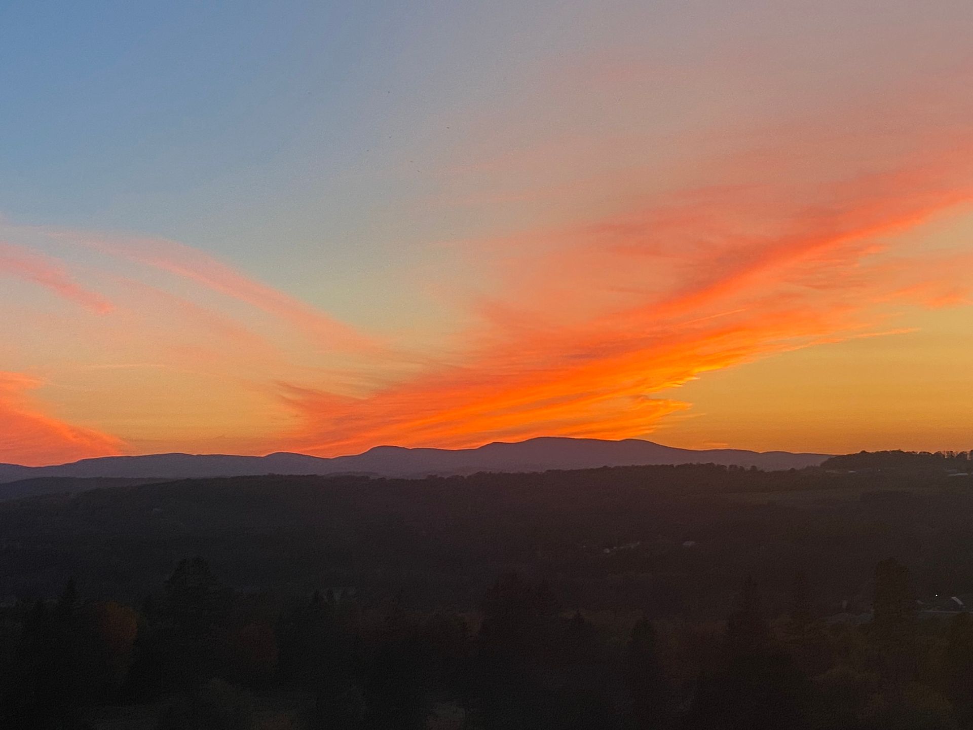 Sunset over Vermont hills and forest at Wildflower Inn