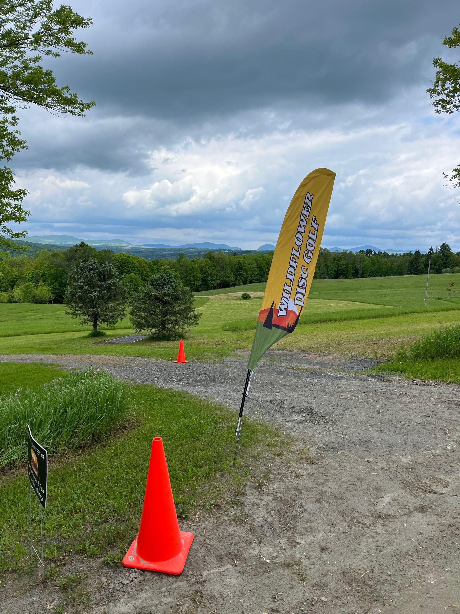 A yellow flag that says ' devils mountain ' on it