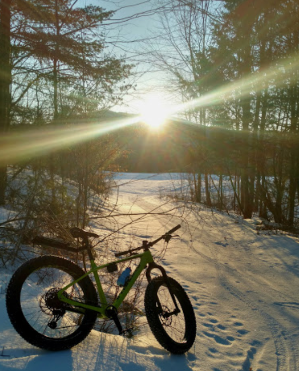 A fatbike parked in the snow on a trail at The Wildflower Inn