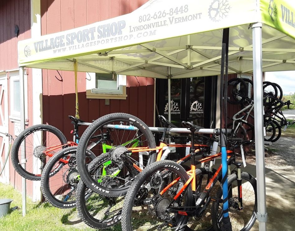 A tent outside The Village Sport Shop displays mountain bike rentals available on The Wildflower property