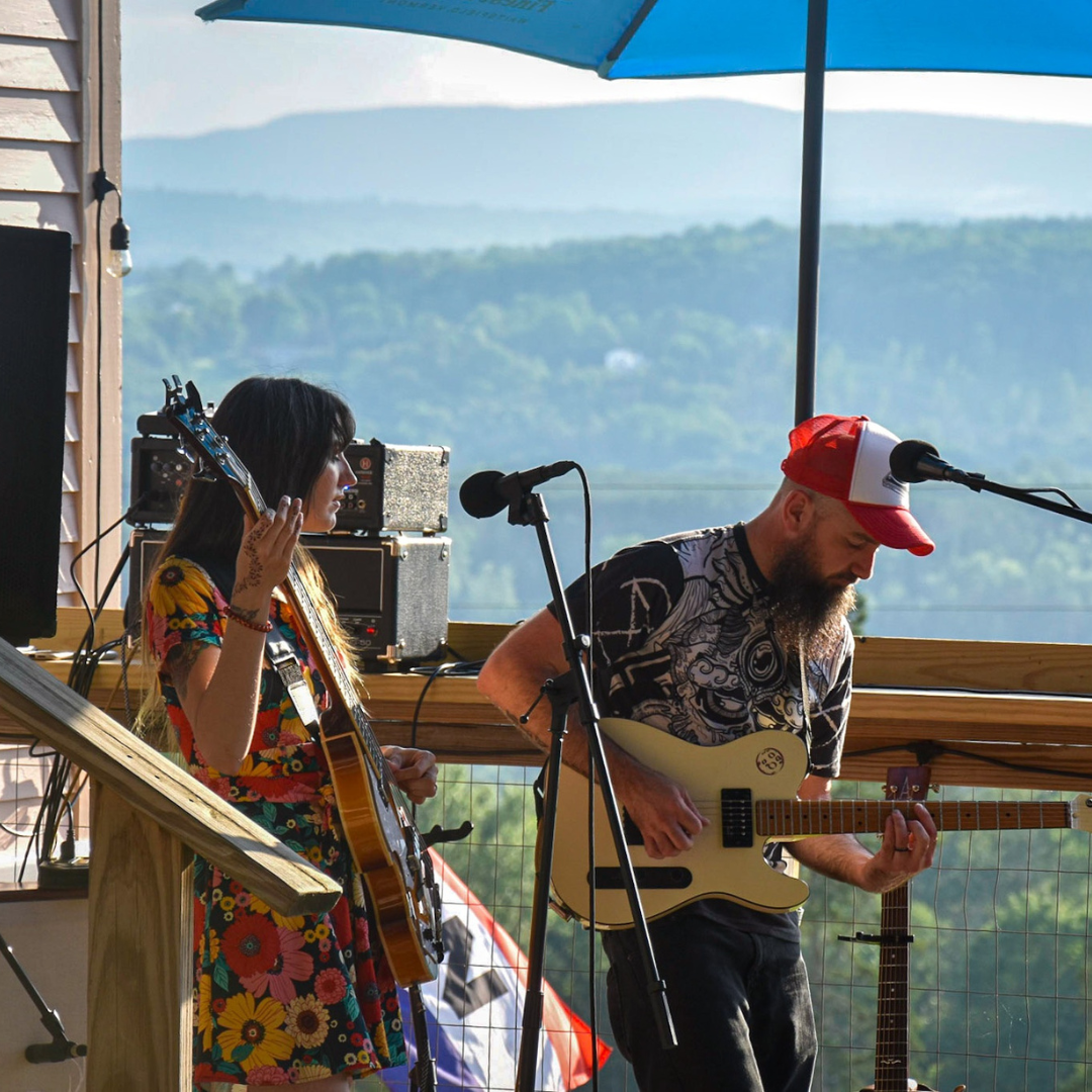 Two musicians performing a live concert in Vermont.