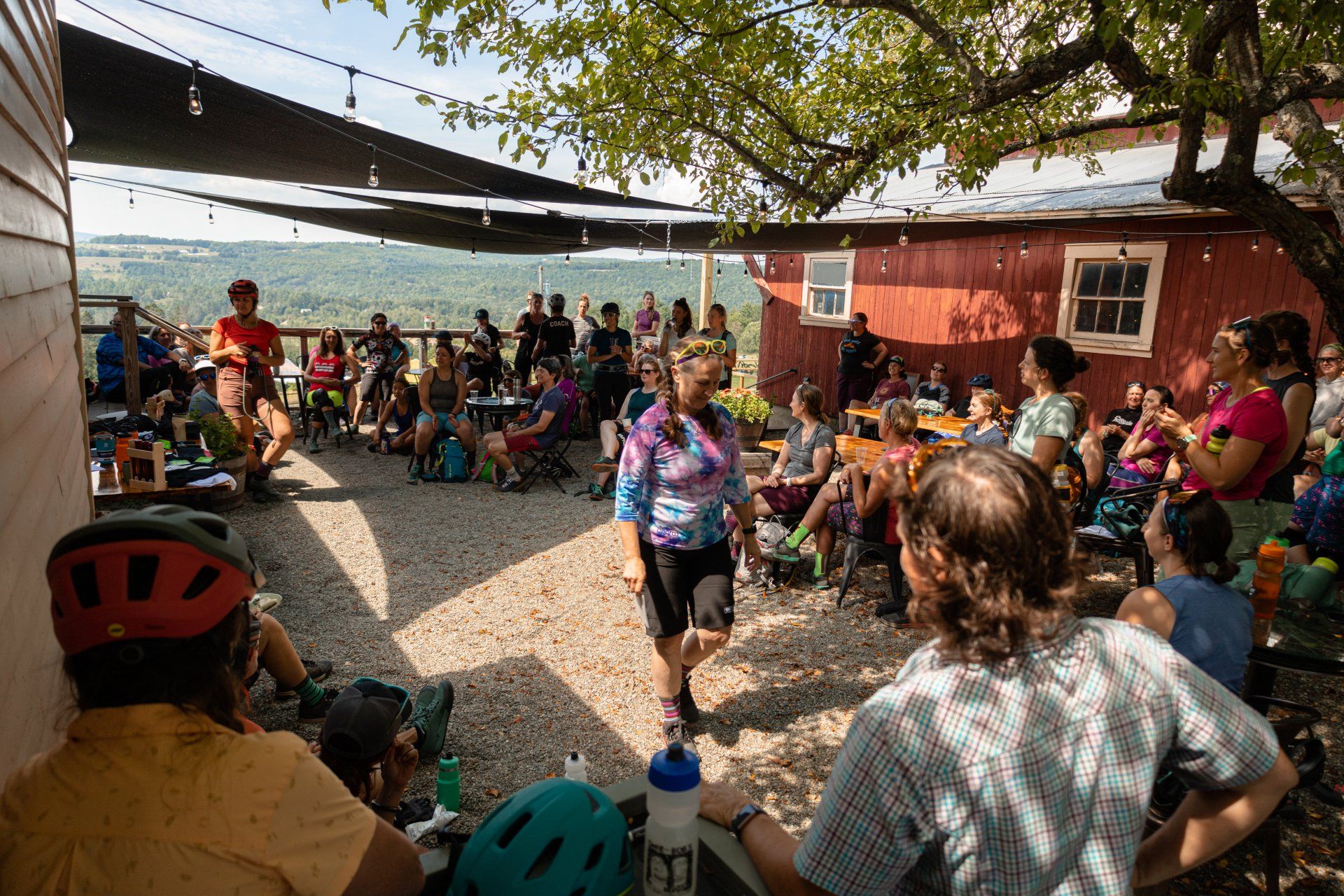 A large group of mountain bikers enjoy the Wildflower Restaurant's Beer Garden following an event.