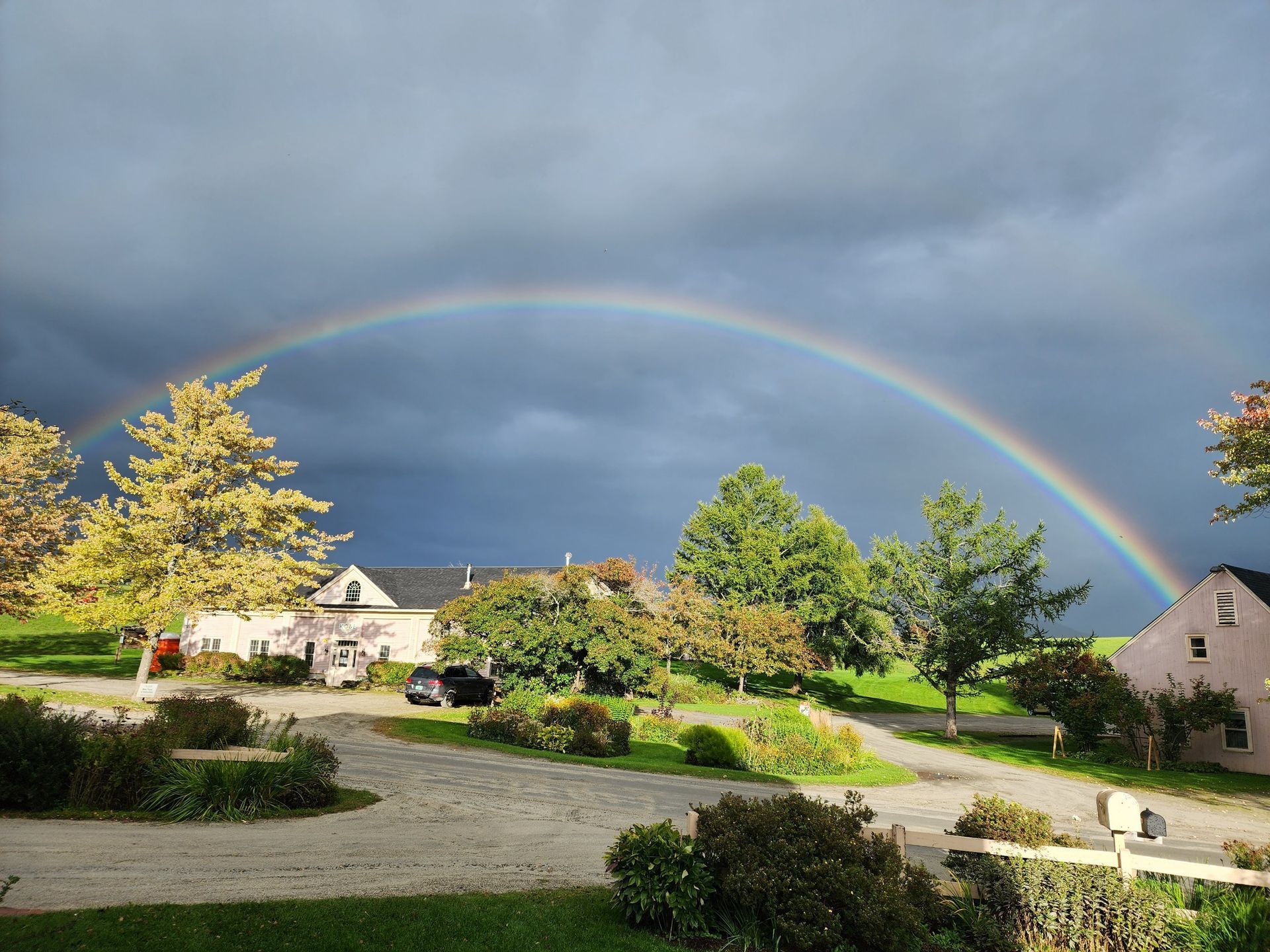 Spring showers in East Burke form a rainbow over The Wildflower Inn, Restaurant, and Bar.