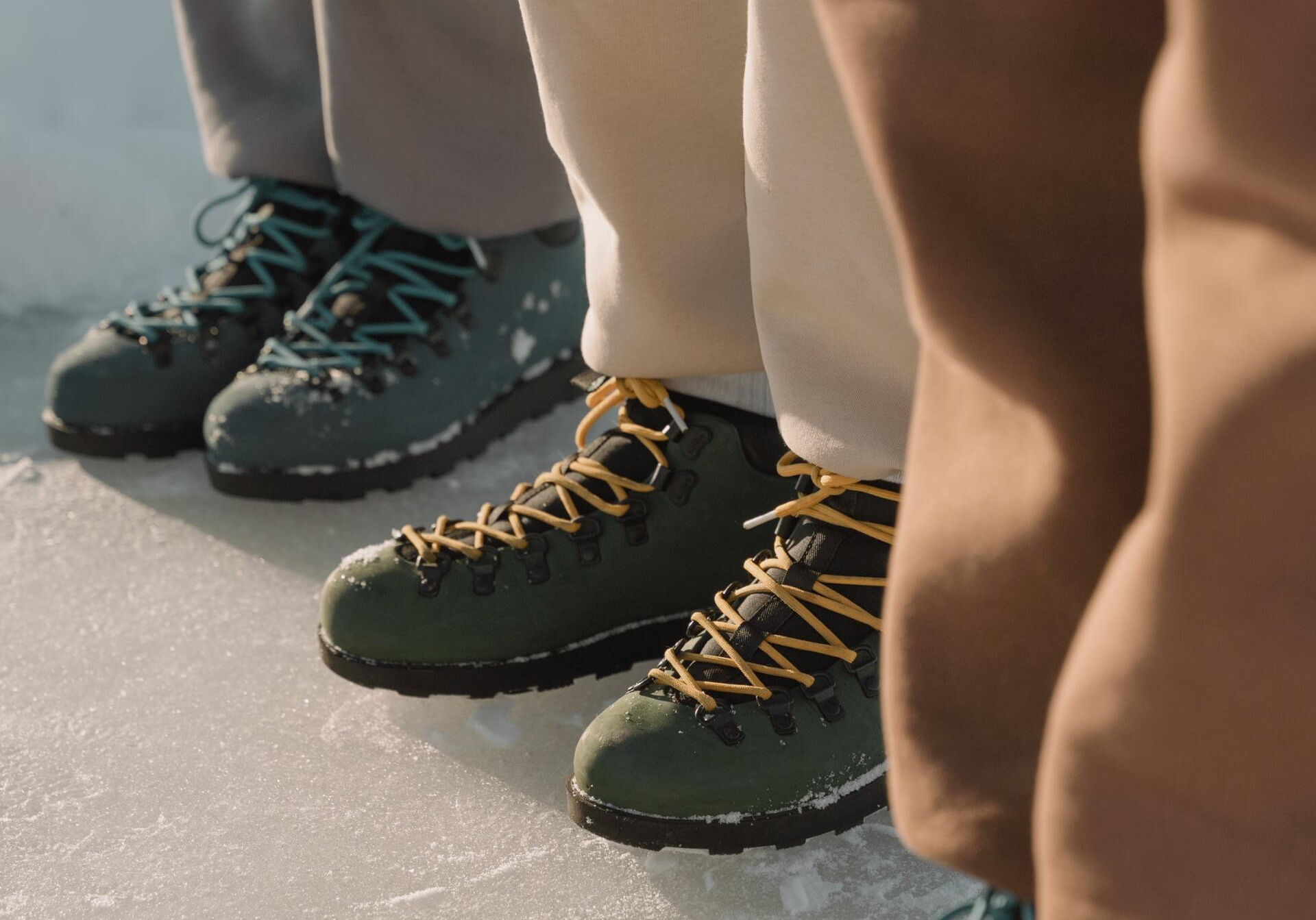 People lined up showing the correct foot wear for a winter hike.