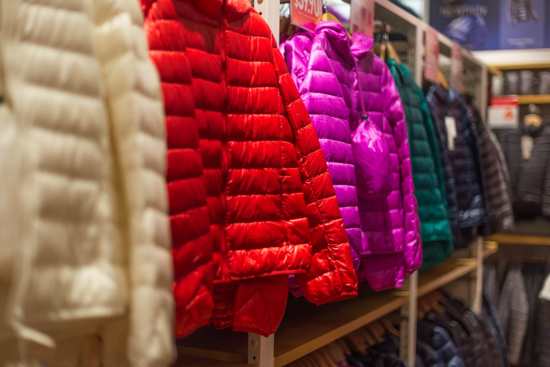 Racks of winter jackets in a clothing store