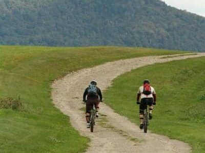 Mountain bikers ride up the trail to Heaven's Bench at The Wildflower