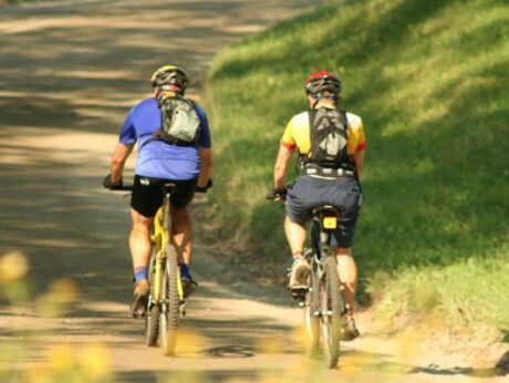 Two mountain bikers ride along one of the many mtb trails at The Wildflower in East Burke, Vermont