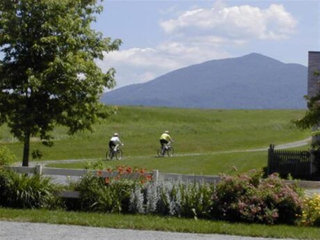 Mountain bikers ride along the trail leading to Heaven's Bench at The Wildflower Inn in Lyndonville, Vermont