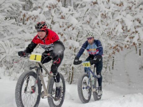 Two people race on a fatbike trail at The Wildflower Inn in Burke, Vermont