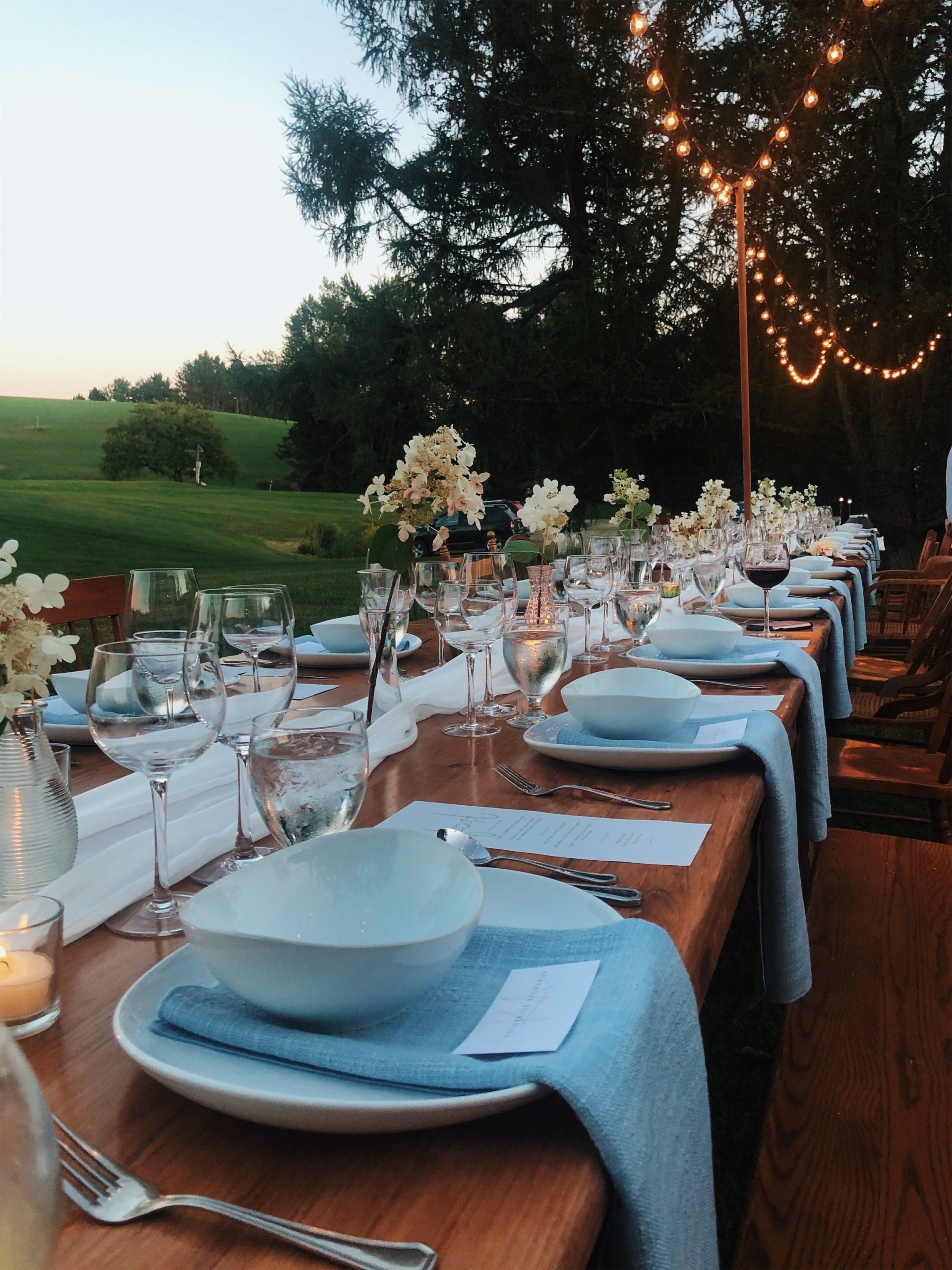 A beautiful wood table is set for a bridal dinner at The Wildflower Restaurant and Bar