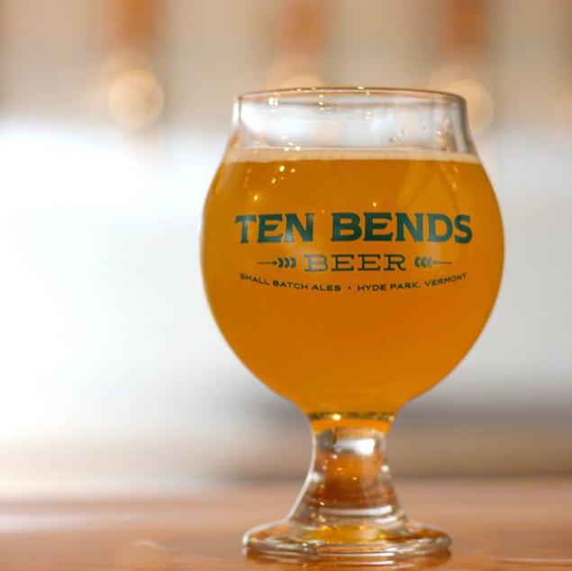 A glass of Ten Bends Beer Small Batch Ale sits on a counter in the restaurant in Hyde Park, Vermont