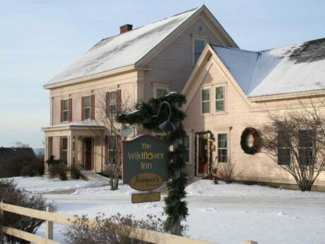 A large house with a sign that says the wildflower inn