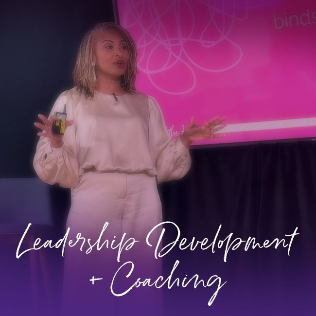 Woman in purple suit holding book