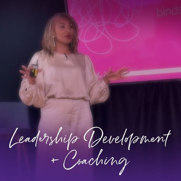 Woman in purple suit holding book