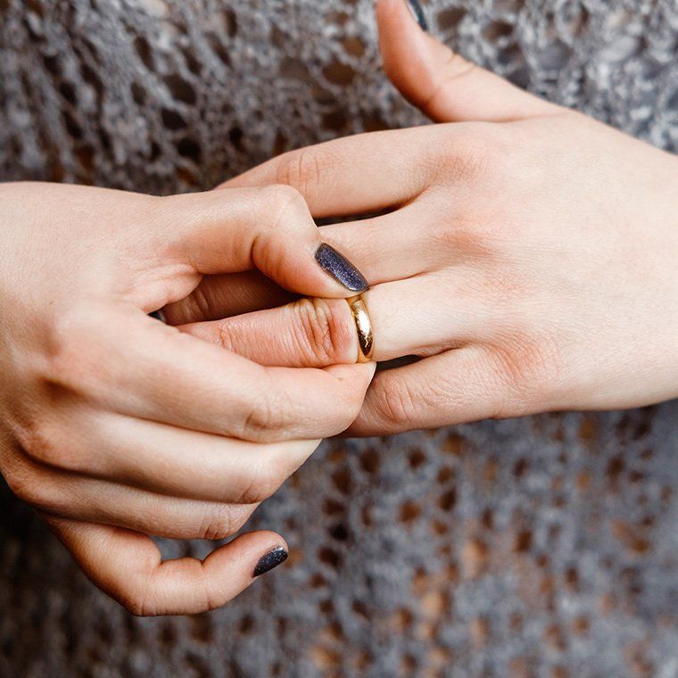 Woman Removing Wedding Ring — Roxboro, NC — Grissom & Holloman, PC